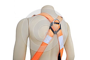 Mannequin wearing construction safety belt on isolated background.