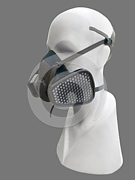 Mannequin wearing protective dust mask.