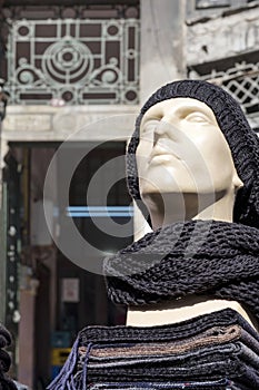 Mannequin wearing a woolly hat and scarf