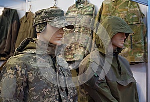 Mannequins in a camouflage military uniform