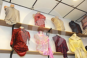 Mannequins with colorful women`s shawls a stoles