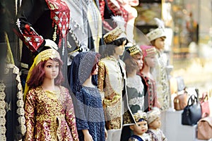 Mannequins dressed in national clothes are displayed in front of a store in Istanbul, Turkey