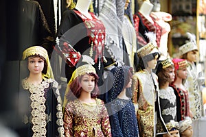 Mannequins dressed in national clothes are displayed in front of a store in Istanbul, Turkey