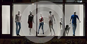 Mannequins in fashion shop, display window