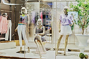 Mannequins in fashion shop window