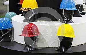 Mannequins with Safety helmets on a shelf ; Working Hard Hat