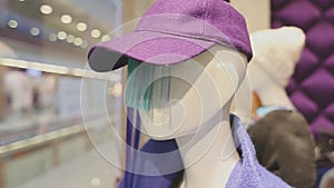 Mannequins in a shop window dressed in trendy designer clothes