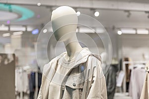 Mannequins in the window of a clothing store. Demonstration of the new collection