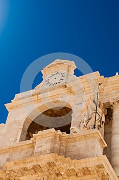 Mannerist style arch with clock on old building