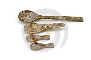 Manny wooden spoon on white background.
