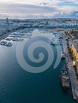 Manoel Island Yacht Marina at sunset with old sailing ship aerial