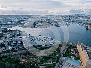 Manoel Island Yacht Marina with towns Gzira and Ta Xbeix at sunset