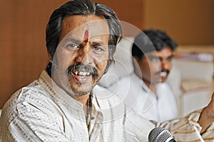 Manoj Desai smiling during a rehearsal