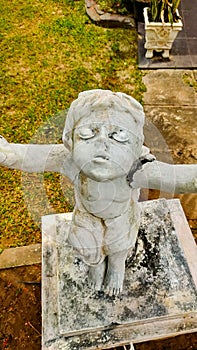 Manokwari, February 23 2023, statue of a little angel in the church yard