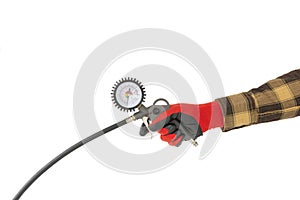 Manometer for car tyre pressure setting in the hand of a worker