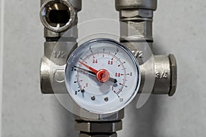 Manometer close up in heating system in boiler room