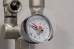 Manometer close up in heating system in boiler room