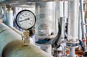 Manometer on the hot water pipeline in the boiler room.