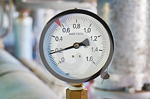 Manometer on the hot water pipeline in the boiler room.