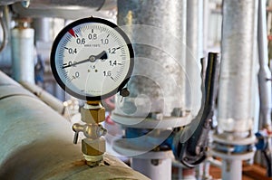 Manometer on the hot water pipeline in the boiler room.