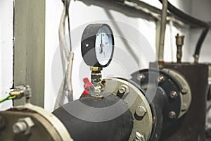 Manometer on house heating pipe in boiler ouse