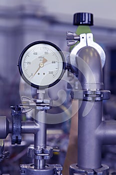 Manometer in nuclear laboratory, industrial blue toned