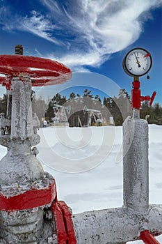 Manometer Pipeline Oil pressure gauge shows 1,75 MPa (Max 2,75 MPa - red line. Oil pumpjack winter working.