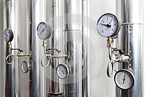 Manometer, pipes and faucet valves of heating system in a boiler