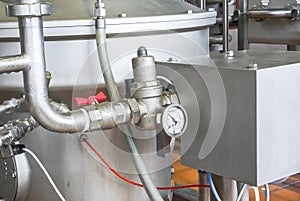 Manometer on a shining tube. Equipment for food industry