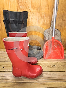 Mans and boys red rubber boots with spades