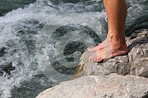 Mans feet on a stone, ready for hardening