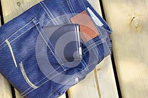 Mans folded jeans and wallet