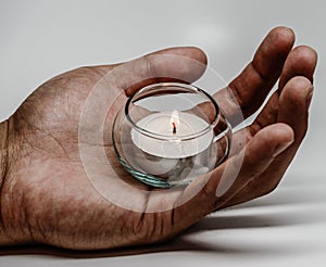 Mans hand and candlelight