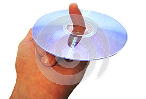 Mans hand holding compact disc on the finger isolated