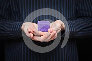 Mans hands holding jewlery box
