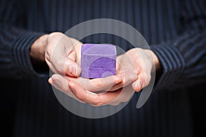 Mans hands holding jewlery box photo