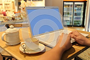 mans hands keyboarding on laptop computer in