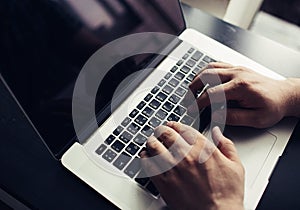 Mans hands on laptop. Business man work on computer