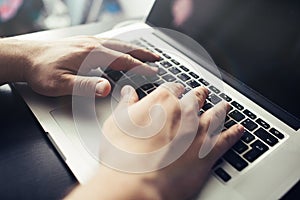 Mans hands on laptop. Business man work on computer