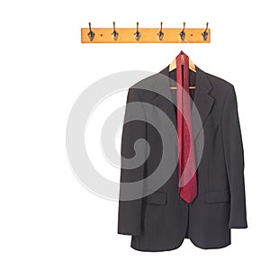 Mans grey suit jacket and tie on hanger, hung up and isolated on white. Retirement, redundancy concept or working late. photo