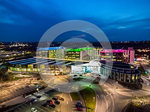 Mansfield Sutton in Ashfield Modern NHS Kings Mill hospital building lit up bright colourful night exterior aerial view drone