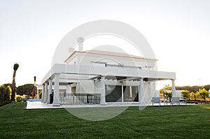 Summer White Residence with Backyard Golf Course photo