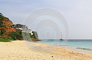 Mansion on a Cliff with Catamaran on the Sea