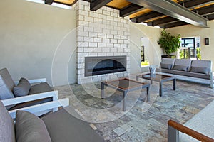 Modern home outdoor plaza patio with fireplace photo