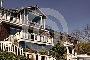 Mansion house on blue sky. Suburb architecture. Suburban housing