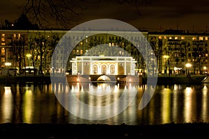 Mansion on the Patriarch Ponds in Moscow at night with reflecti photo