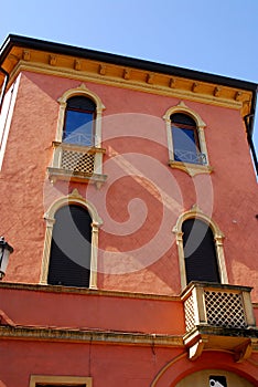 A mansion with a red side and narrow near the Basilica of St. Anthony in Padua in the Veneto (Italy)