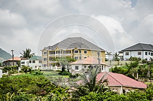 Mansions on green hillside photo