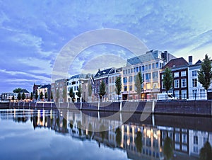 Mansions mirrored in a harbor at twilight, Breda, Netherlands
