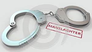 MANSLAUGHTER stamp and handcuffs. Crime and punishment related conceptual 3D rendering photo